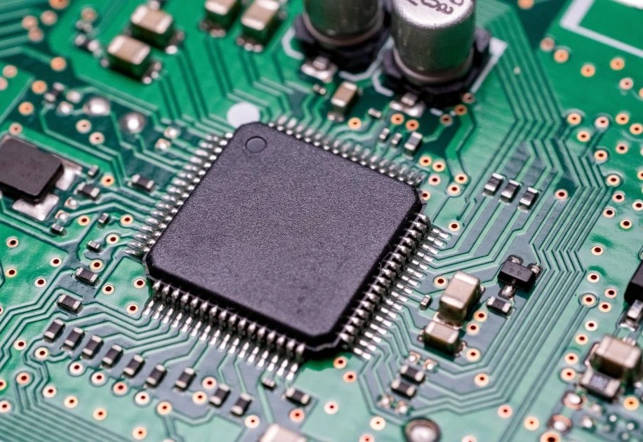 Close-up of a populated PCB with a microcontroller